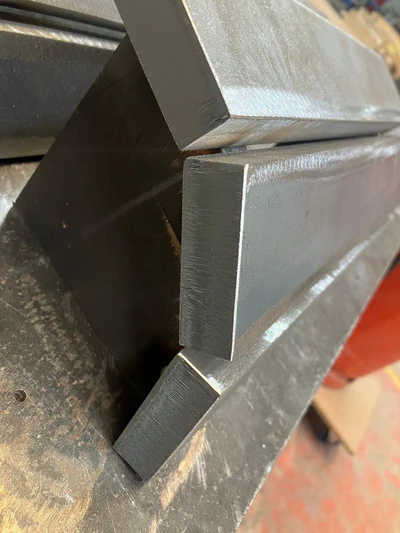 Straight bars ready to be welded into a curved shape