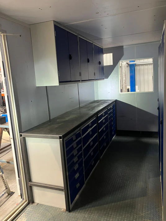 A row of drawers with a metal top