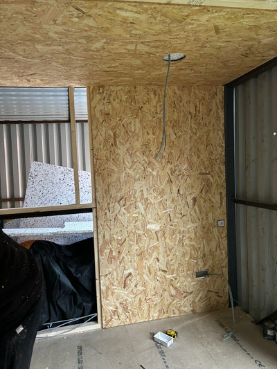 Wooden boarded walls inside a garden shed