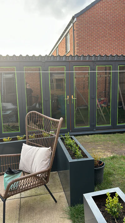 A row of folding doors on a garden shed
